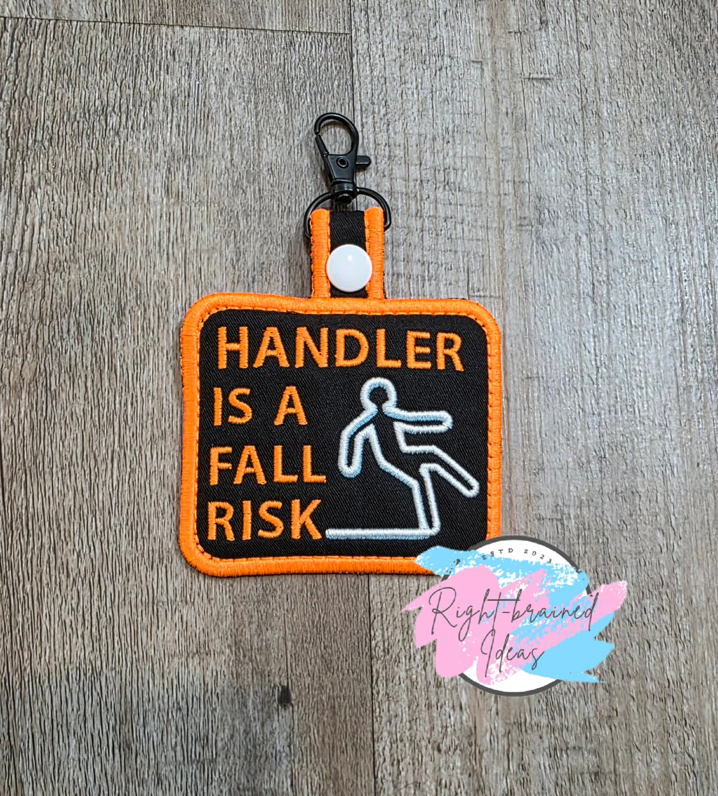 *Minor Cosmetic Flaw* Handler Is A Fall Risk Neon Orange, White And Light Blue On Lightweight High Performance Black Twill Patch Tab