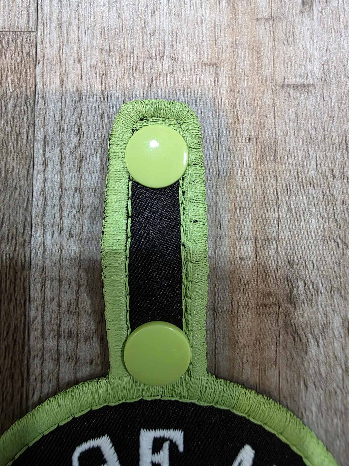 *Minor Stitch Flaw* Leaf Me Alone Flat Matt Light Green/White And Satin Green On Lightweight High Performance Black Twill Patch Tab