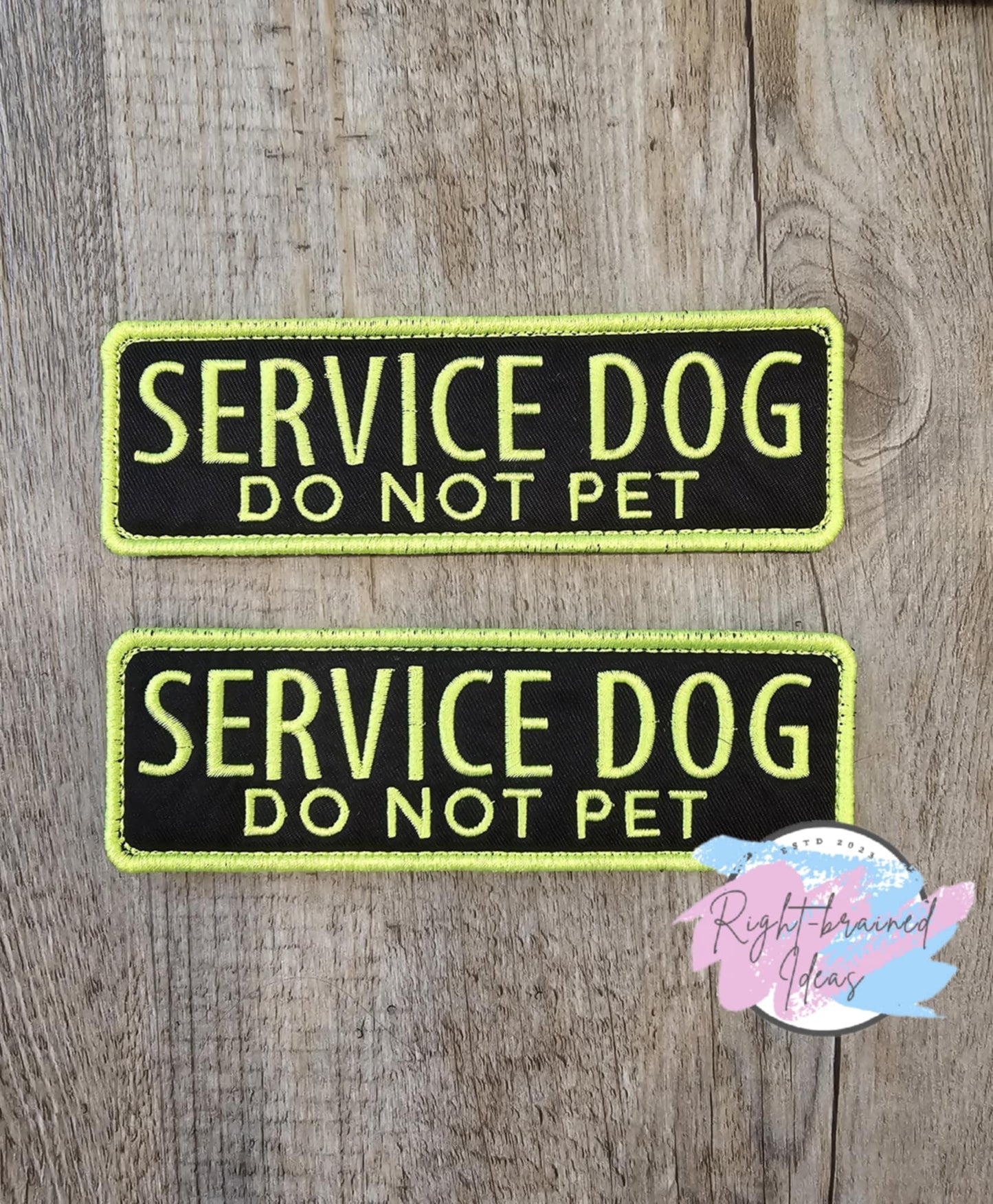 Do Not Pet Service Dog Neon Yellow on Black Canvas Rectangular Patches. This is a two-piece set that is made with black twill material and neon yellow embroidery thread to help stand out that your four-legged companion is working by telling everyone, "Service Dog, Do Not Pet." These patches come with velcro on the backside.
(2) 6in x 2in rectangular patches: "Service Dog Do Not Pet"