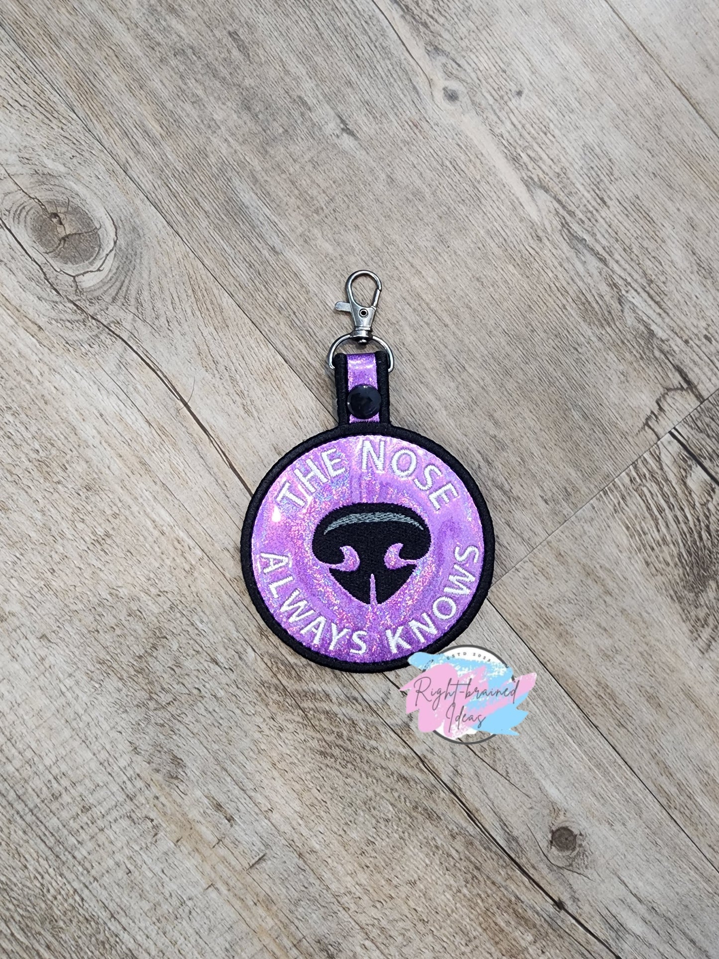 The Nose Always Knows Black on Sparkle Purple Holographic Vinyl Patch Tab