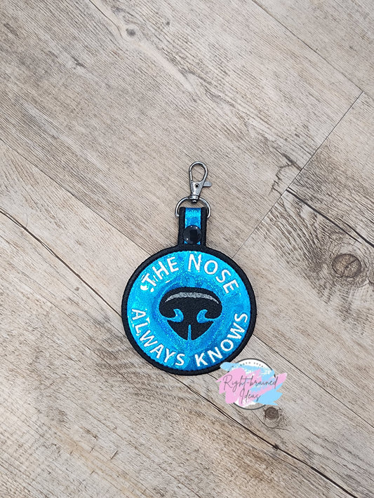 The Nose Always Knows Black on Sparkle Blue Holographic Vinyl Patch Tab