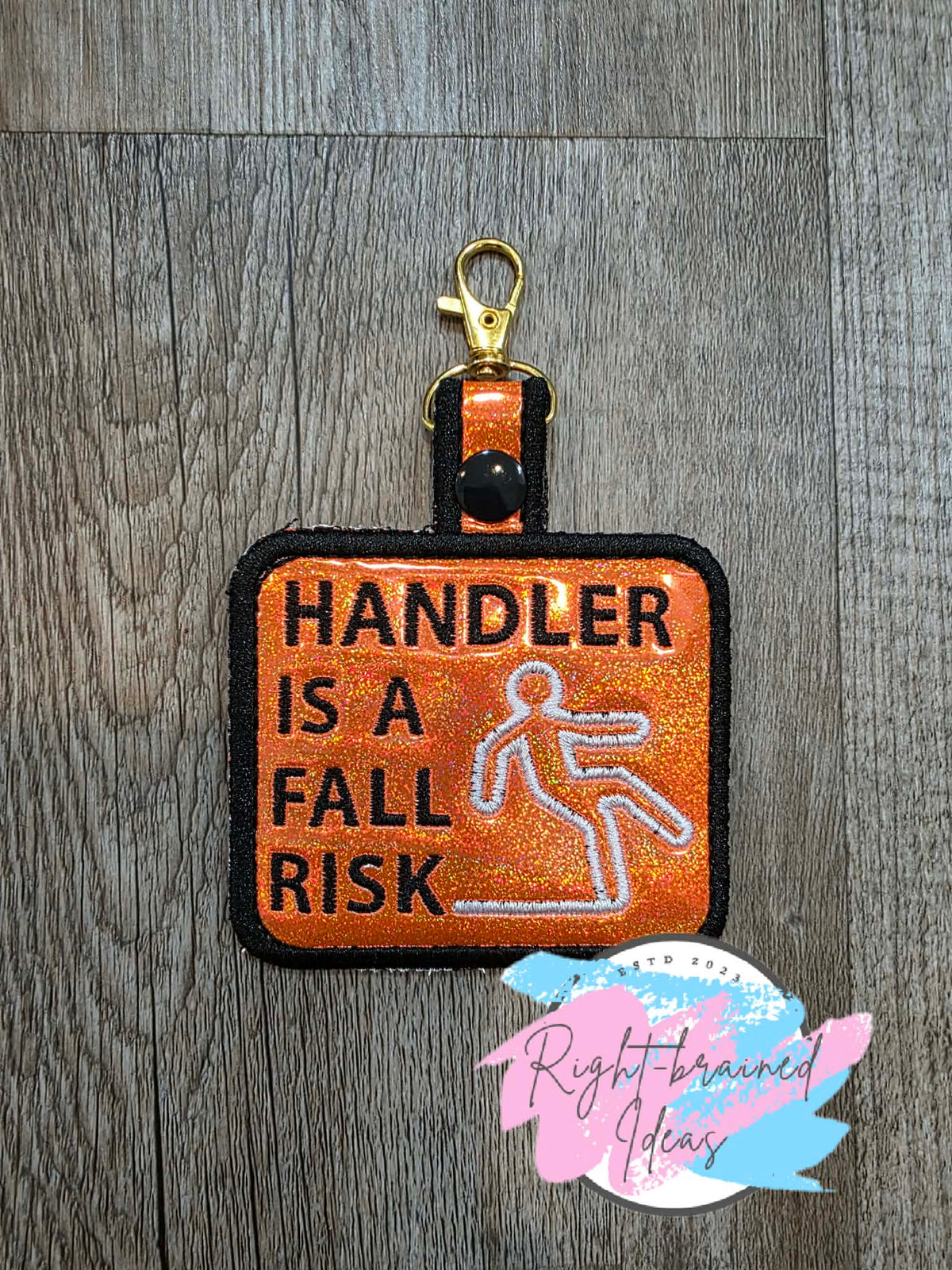 *Minor Cosmetic Flaw* Handler Is A Fall Risk Black And White On Sparkle Orange Holographic Patch Tab