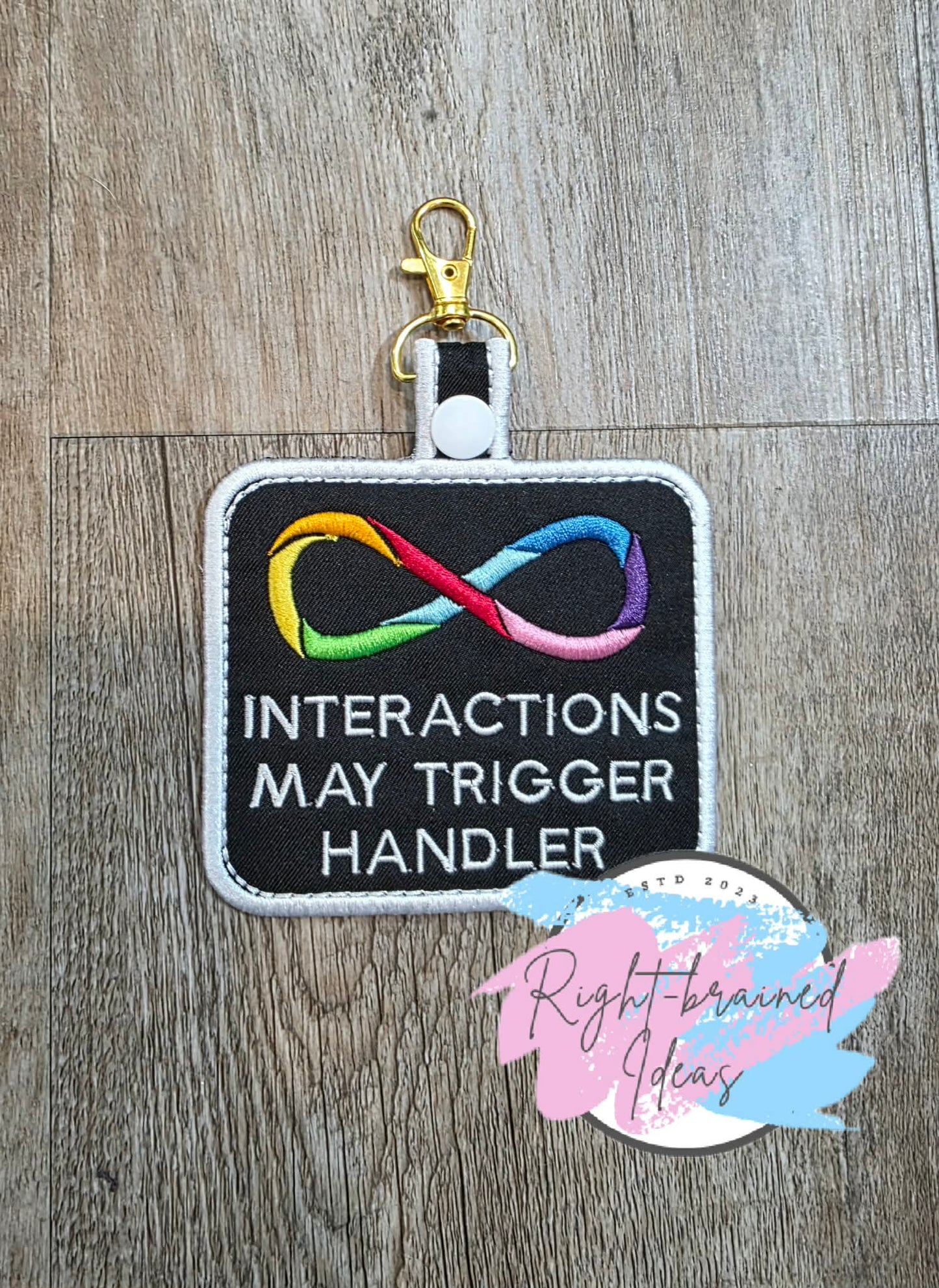 Infinity Loop Rainbow Palette Of Colors And White On Lightweight High Performance Black Twill Patch Tab