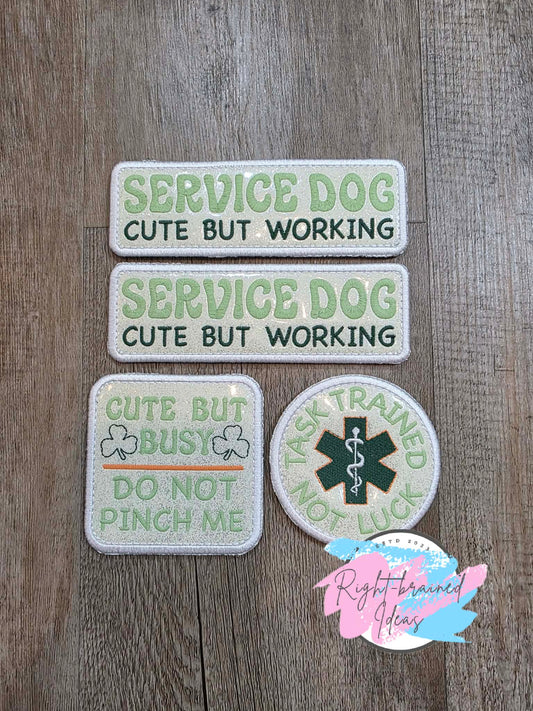 Shamrock Inspired Service Dog Cute But Working Flat Matt Mint Green, Flat Matt Forest Green, Flat Matt Orange And White On Sparkle White Vinyl Four-piece Patch Set