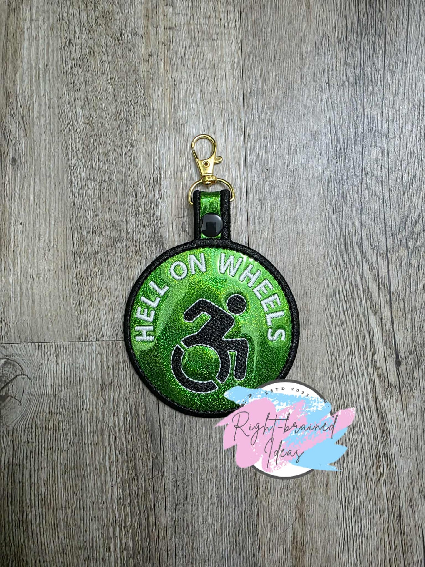 Hell on Wheels Glow-In-The-Dark White And Black On Sparkle Green Holographic Patch Tab