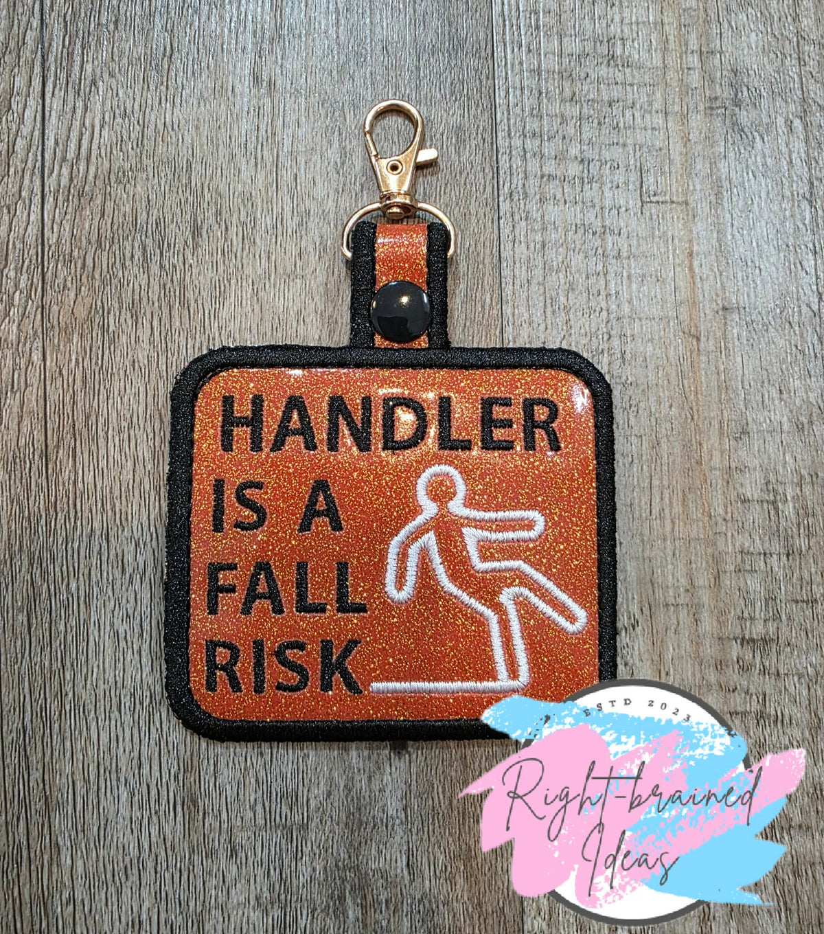 Handler Is A Fall Risk Black And White On Sparkle Burnt Orange Vinyl Patch Tab