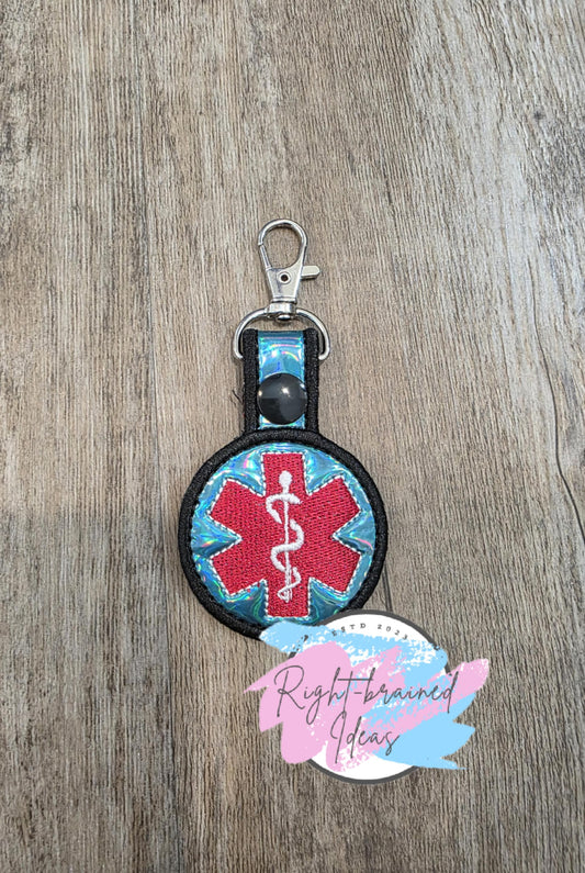 Medical Symbol Red, White and Black on Teal Blue Holographic Vinyl Mini Patch Tab