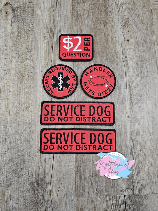 This is a basic five-piece service dog gear set. The set is made with red canvas, black and white embroidery thread and velcro on the backside.&nbsp;

(2) 6in x 2in rectangular patches: "Service Dog, Do Not Distract"

(1) 3in circular patch: "Access Required by Law" around a medical alert symbol

(1) 3in circular patch: "Handler Gets Dizzy" surrounding a dizzy symbol in the middle.

(1) 3in x 2in rectangular patch: "$2 Per Question"